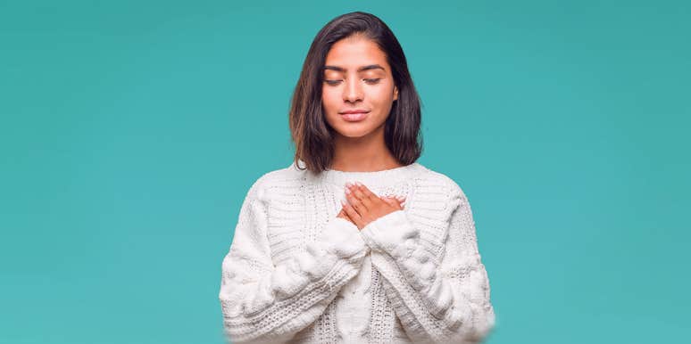 12 Ways Introverts Are The Most Confusing People You'll Ever Meet woman holding hands against her heart