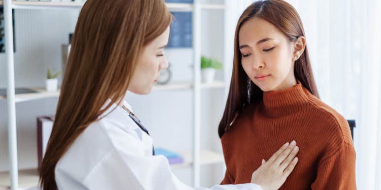 13 Breast Cancer Risk Factors woman getting breast exam at doctors