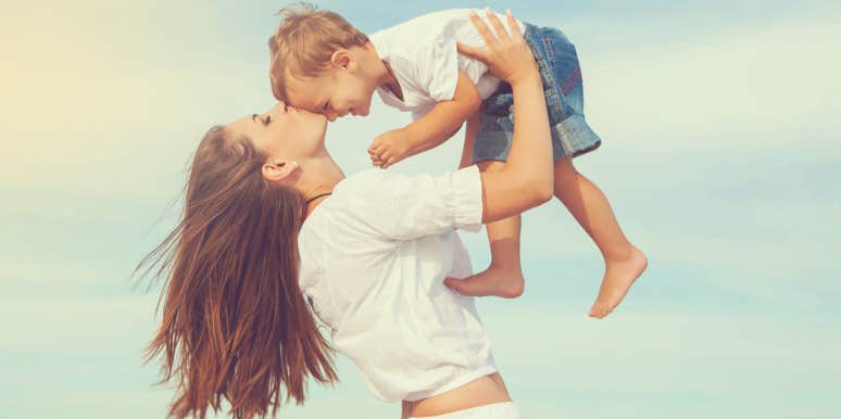The 14 Types Of Moms In Every Mom Group mom holding son in the air