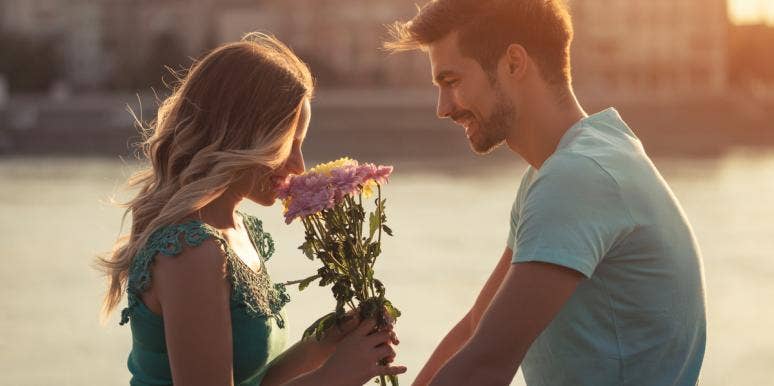 16 Signs He's A True Gentleman (And You Should Marry Him) man giving woman flowers