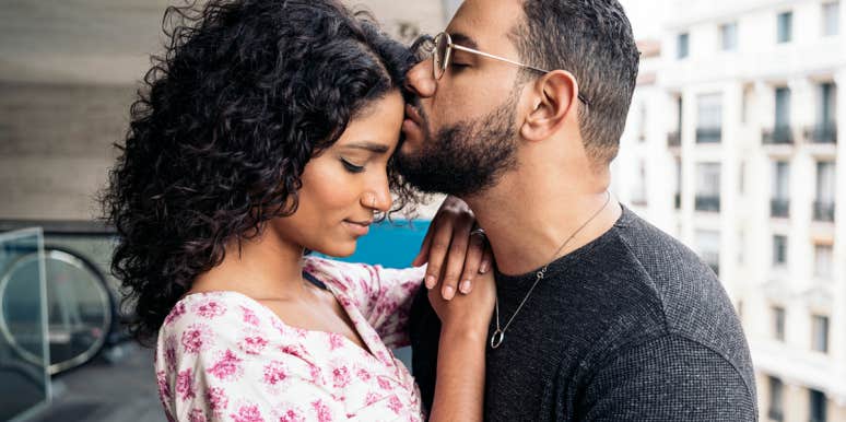 17 Secrets People Who Are Good At Relationships Know That You Don't man kissing woman's forehead