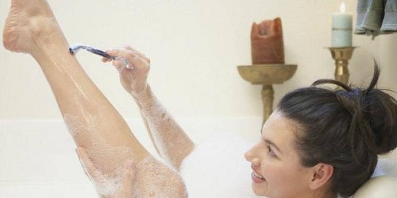 woman shaving legs woman shaving legs