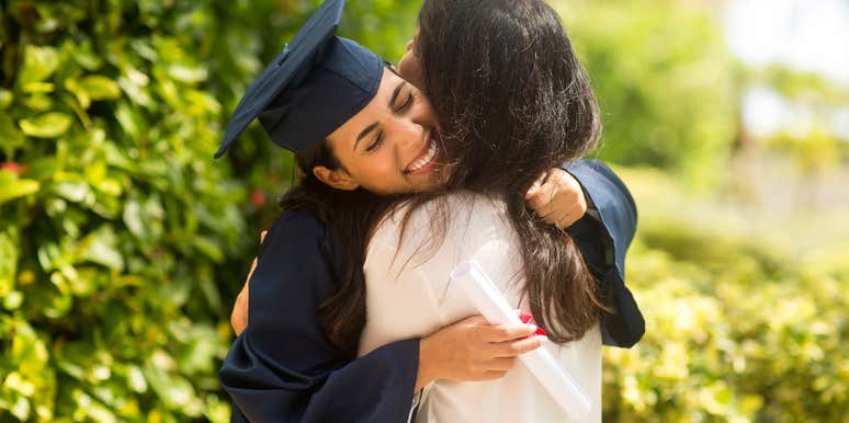 Proud mother hugging her daughter at her graduation