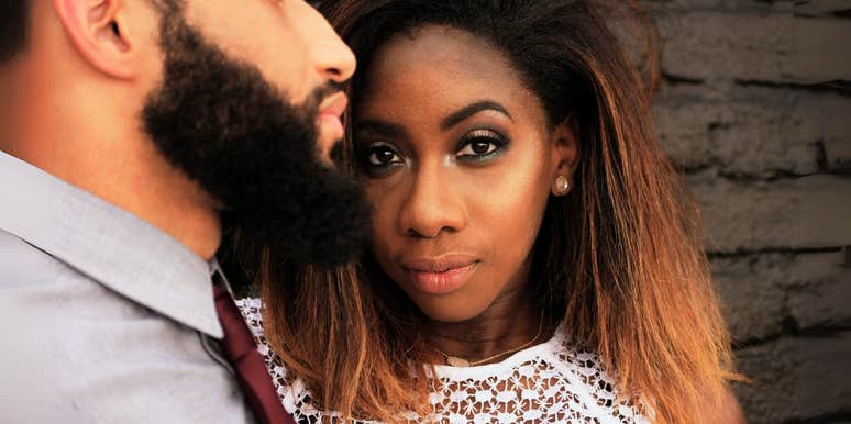 Confident woman standing by man.