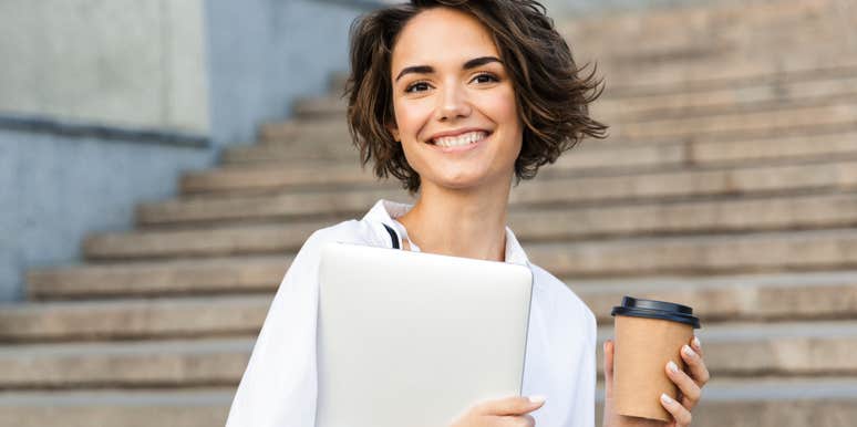 Young woman with laptop practicing hot girl habits for a better life