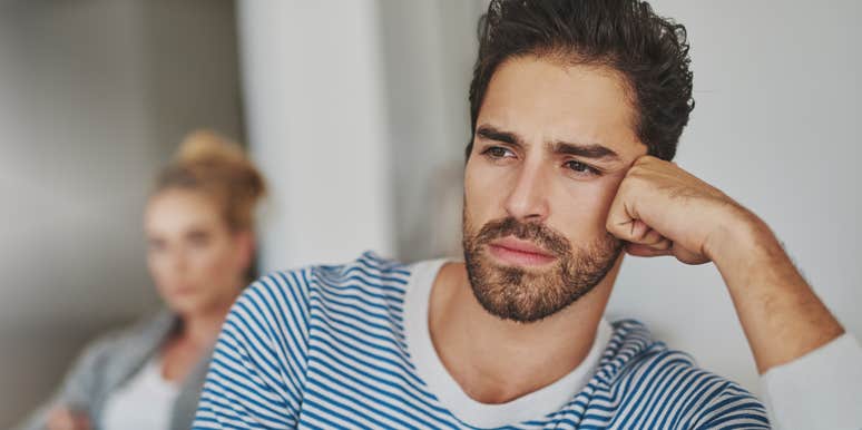 annoyed man turned away from wife