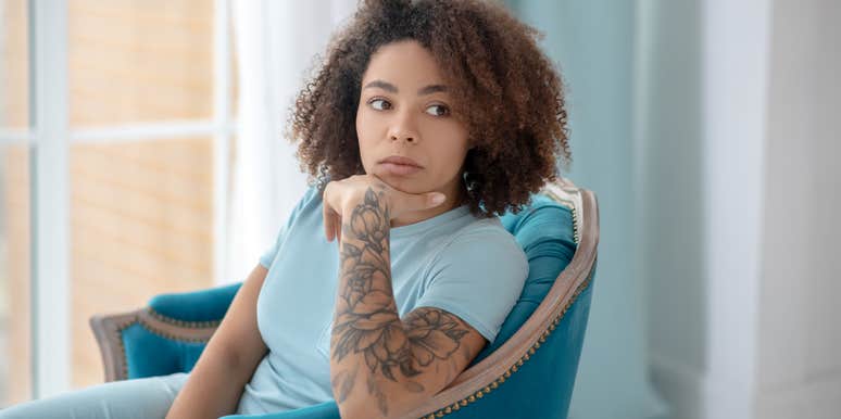 woman questioning if she should cover her tattoos for her boyfriend's family dinner