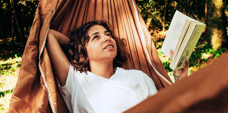 Woman on a hammock with low-effort habits, making life so much easier.
