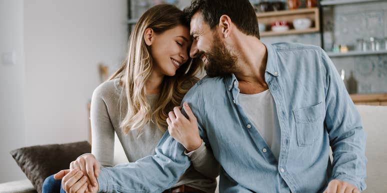extremely happy couple getting close together
