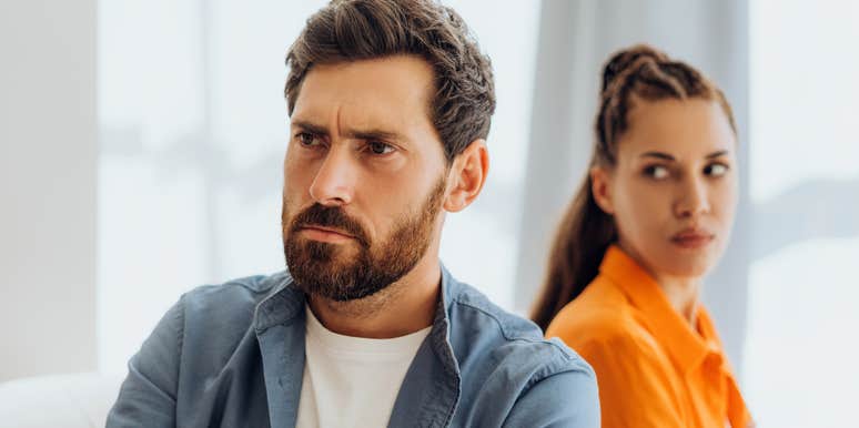 immature husband turning away from annoyed wife