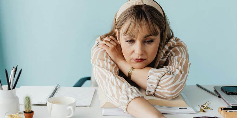 Woman drained by energy vampires at work