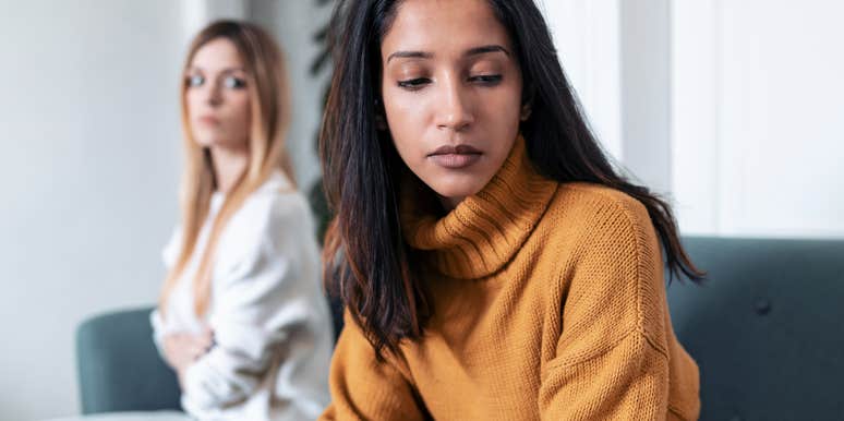 woman turned away from friend who feels entitled to her time and energy