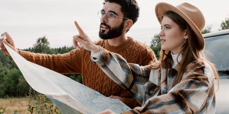 couple with no sense of direction trying to navigate from a map