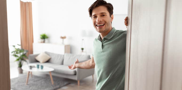 loyal man opening the door to his home to woman