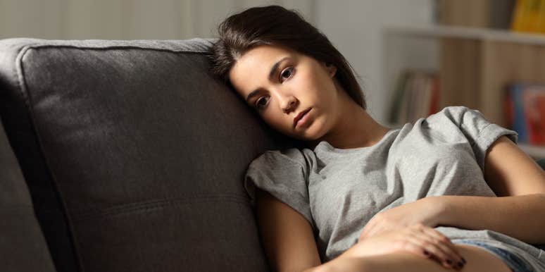 anxious adult sitting on couch