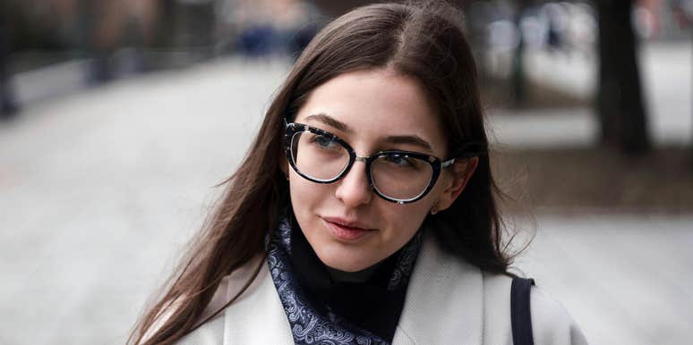 Woman who is looking at a specific body part to determine how smart someone is