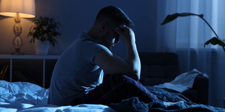 gen z man awake night thinking money problems