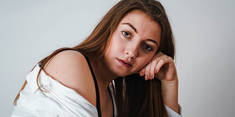 woman hearing question partner asks before they cheat