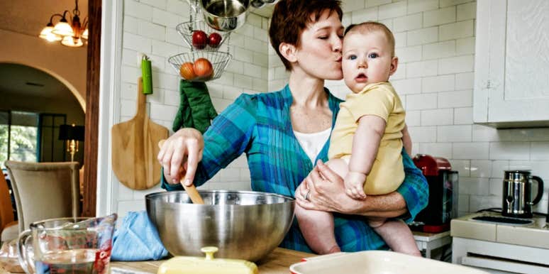 woman kissing baby