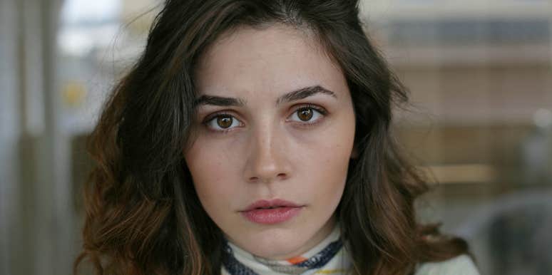 woman secretly struggling looking upset