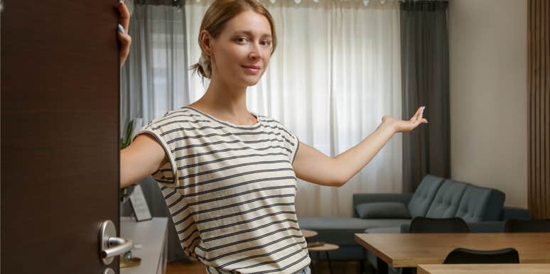 host welcoming guests into her home
