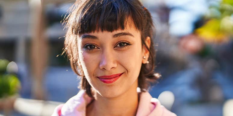 assertive young woman smiling confidently