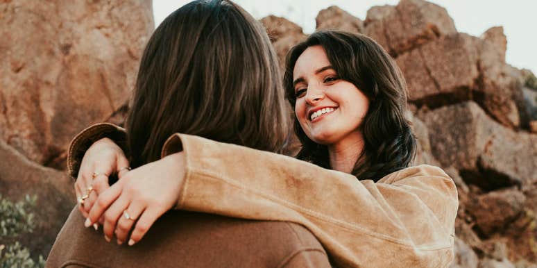 Smiling couple sharing a magnetic connection, representing the invisible factors that create attraction between two people.