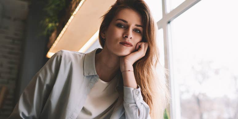 pensive woman sitting in a cafe