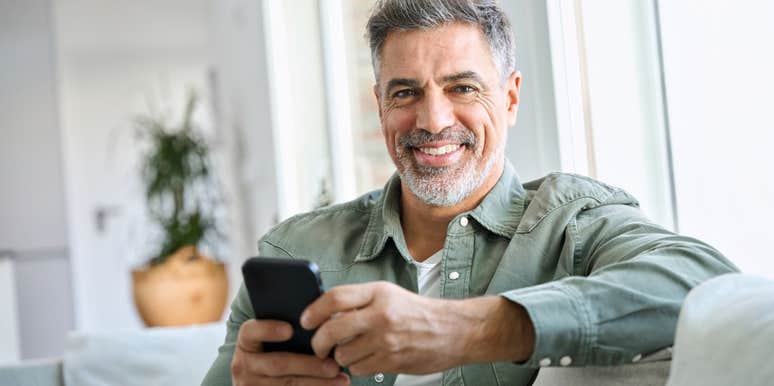 happy man in love and texting his wife
