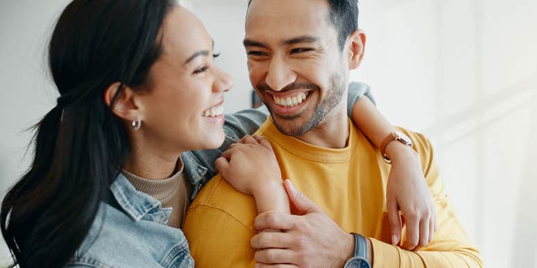happy husband looking at wife in healthy marriage