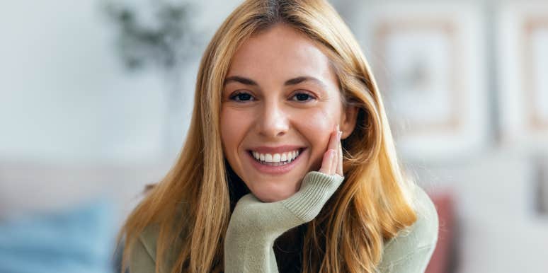 resilient woman smiling after surviving rock bottom