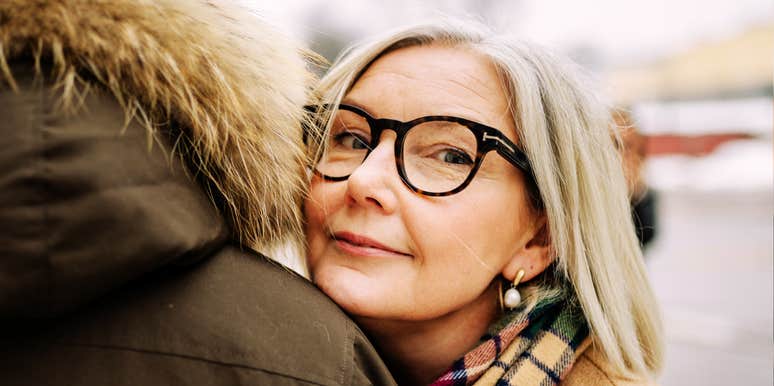 Woman leaning on man for comfort, representing emotional connection, compassion, and true love during times of loss