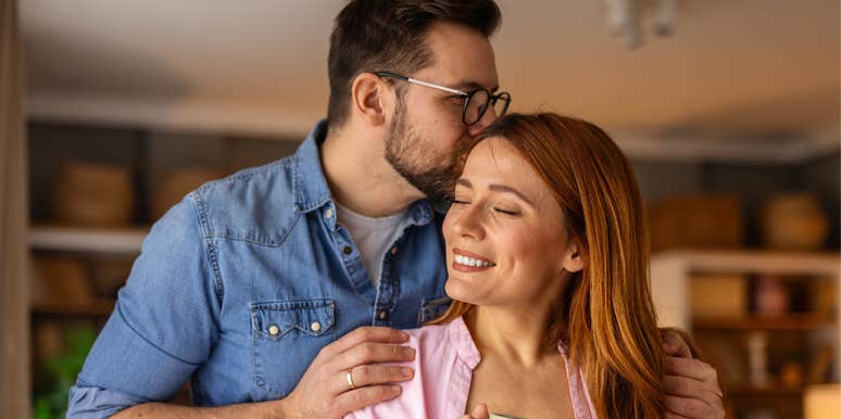 loving man kissing his partner's head
