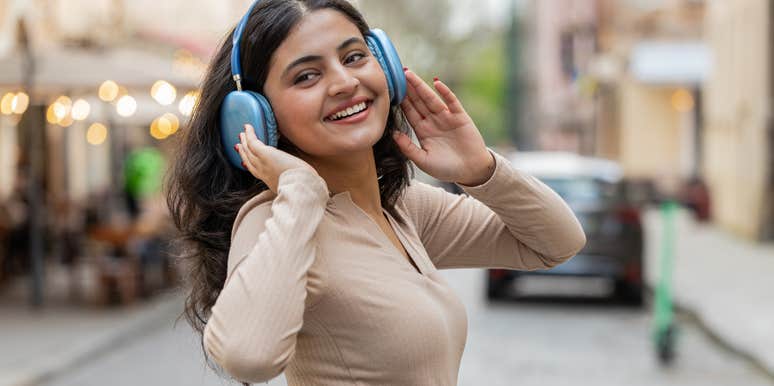 intelligent woman listening to music to calm herself