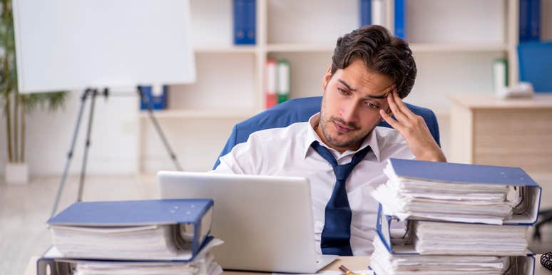 stressed employee sitting at desk