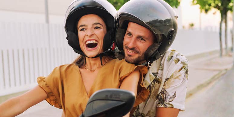 Confident, secure girl riding a motorcycle showing the art of being secure and habits of people who aren’t frantic about being loved.