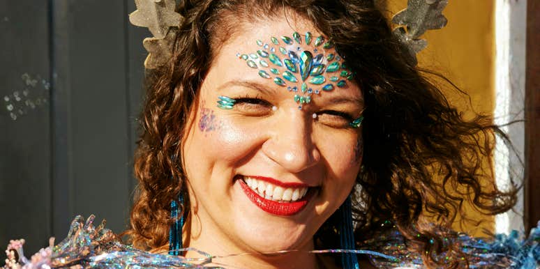 Confident, whimsical woman showing the art of pixie dust and habits that make all dreams come true.