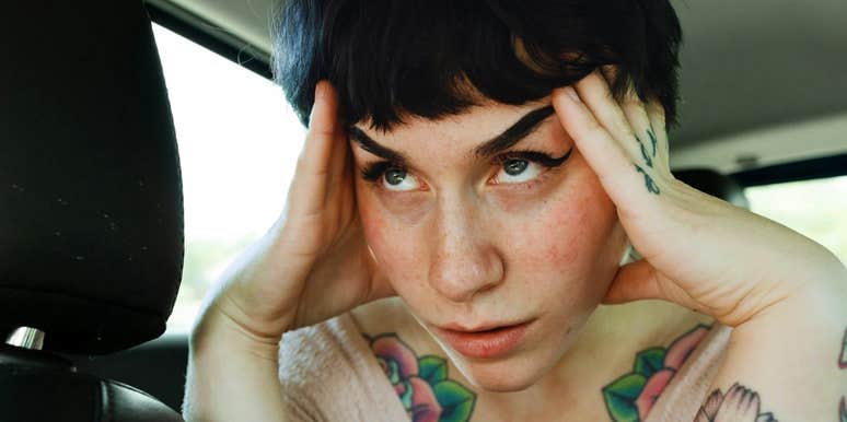 Overwhelmed person pausing for a grounding moment showing the tiny calming fixes to try before you spiral from stress and anxiety.