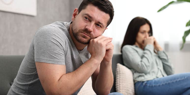 man losing interest in his partner turned away from her