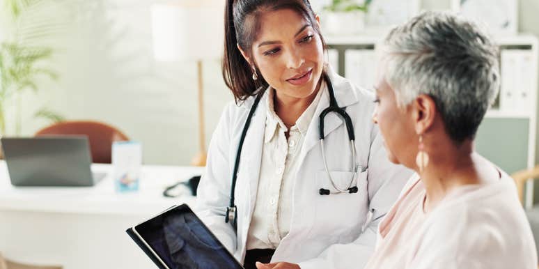 woman getting checkup at doctor's office