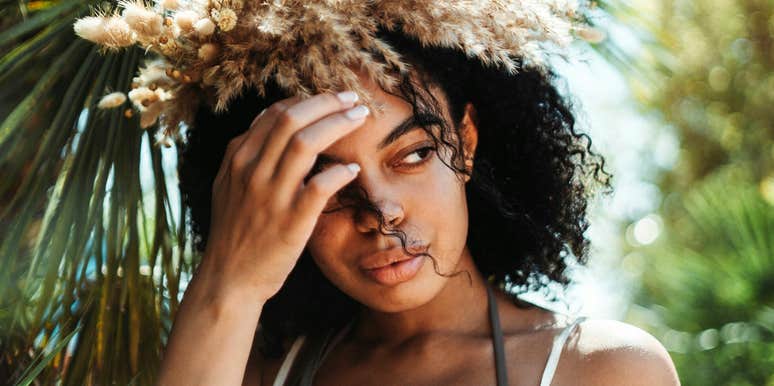 Pensive woman reflects on the painful truths, after getting burned in relationship.