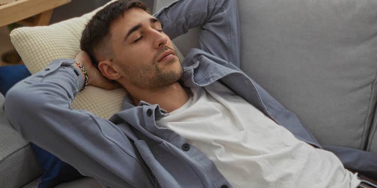 man sleeping on the couch by choice