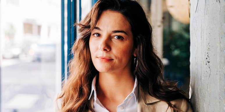 Successful business person looking pensive, symbolizing the hidden mindset trap that keeps high achievers stuck and how to break free