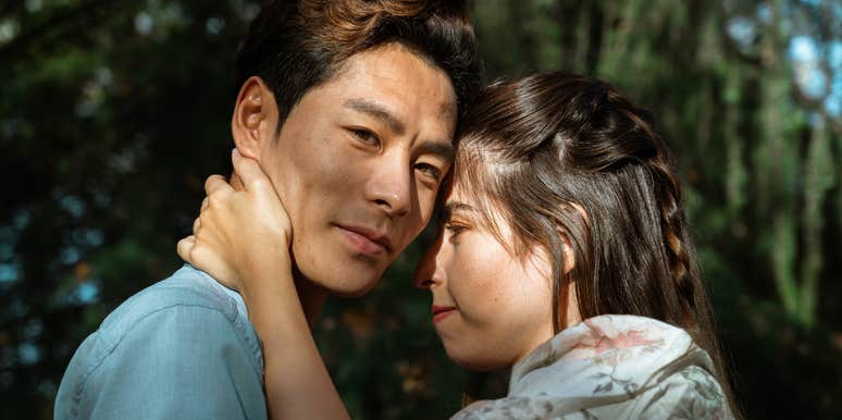 man falling out of love with partner smiling hugging her