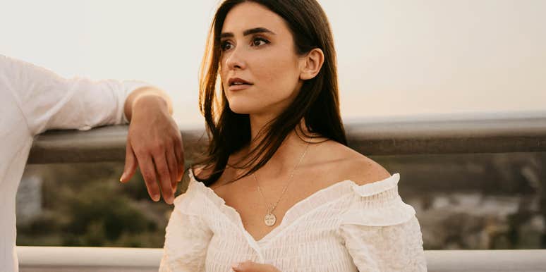 Woman in white dress deep in thought — the haunting truth about what marriage does to those who don’t learn fast enough.