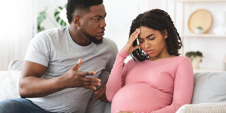 pregnant woman arguing with her boyfriend after their baby's gender reveal