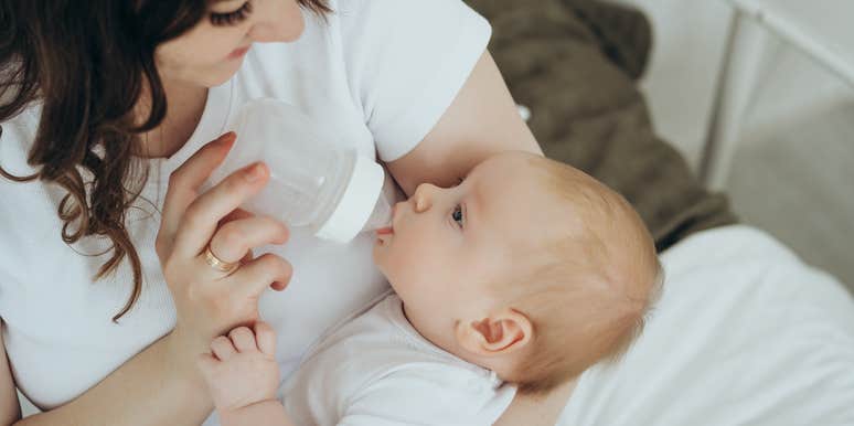 mom feeding her baby formula from a bottle