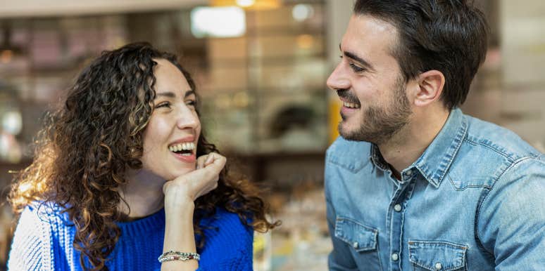 man and woman looking at each other with deep attraction