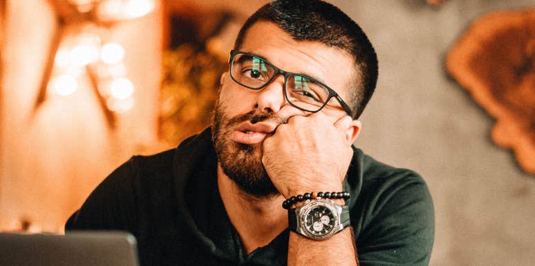 Unmotivated person staring off in boredom, embodying the habits and excuses of people who can’t stop procrastinating.