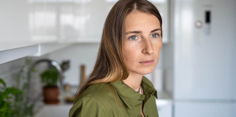 middle aged woman thinking back on being a latchkey kid